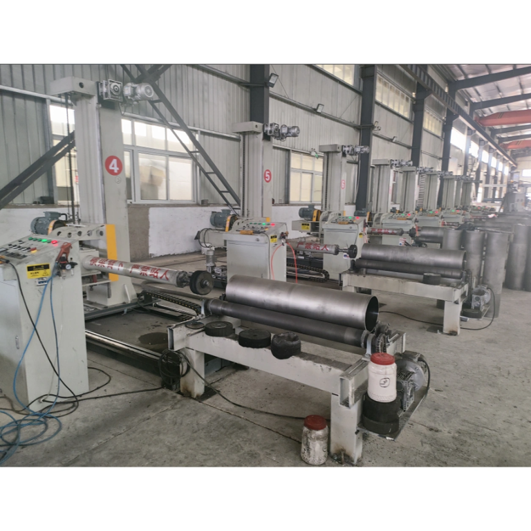 Workshop view of multiple tube-polishing machines and cylindrical workpieces